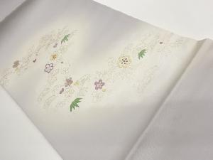 塩瀬金彩曲線に松・笹・花々模様織出し暈し開き名古屋帯（額縁仕立て）